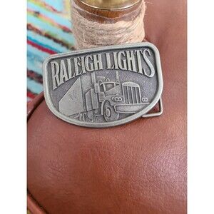 VTG Brass Silver Color Belt Buckle Advertising Raleigh Lights Semi Truck 3"x2"